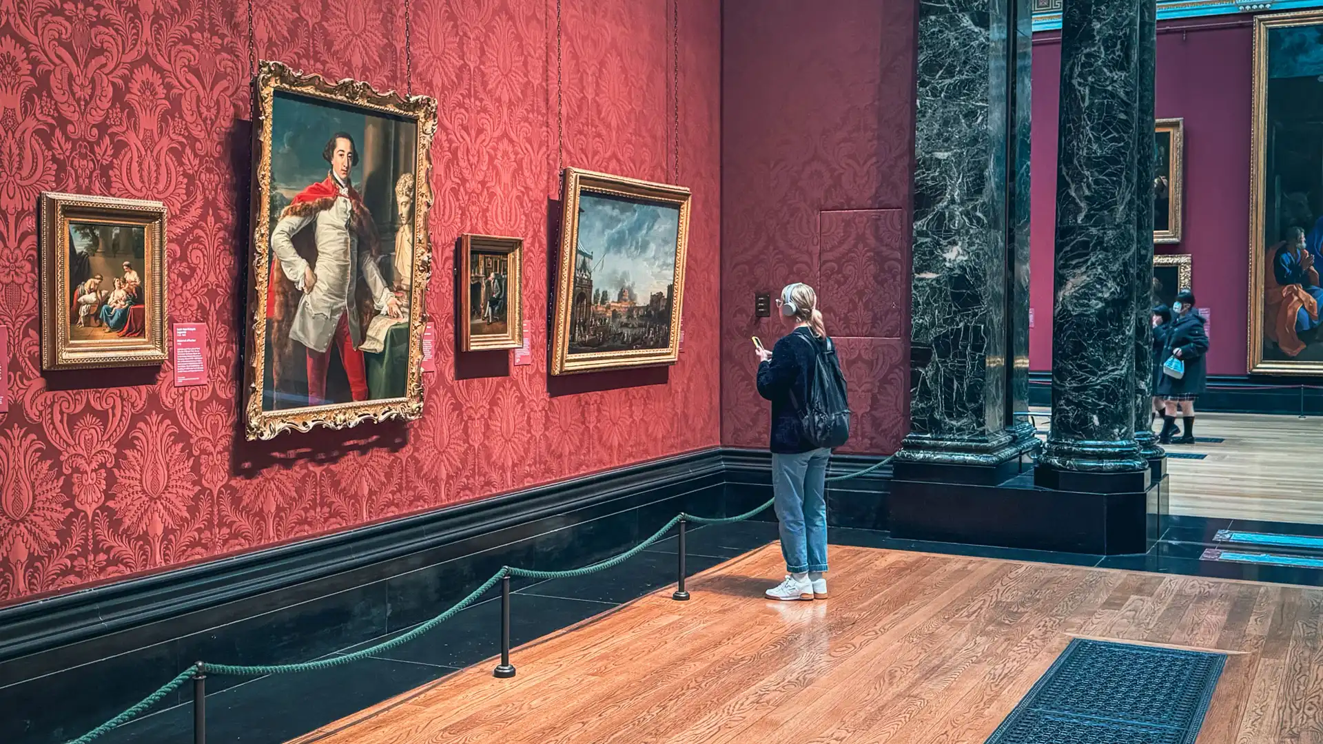 A visitor using The Voice of the Gallery at the National Gallery